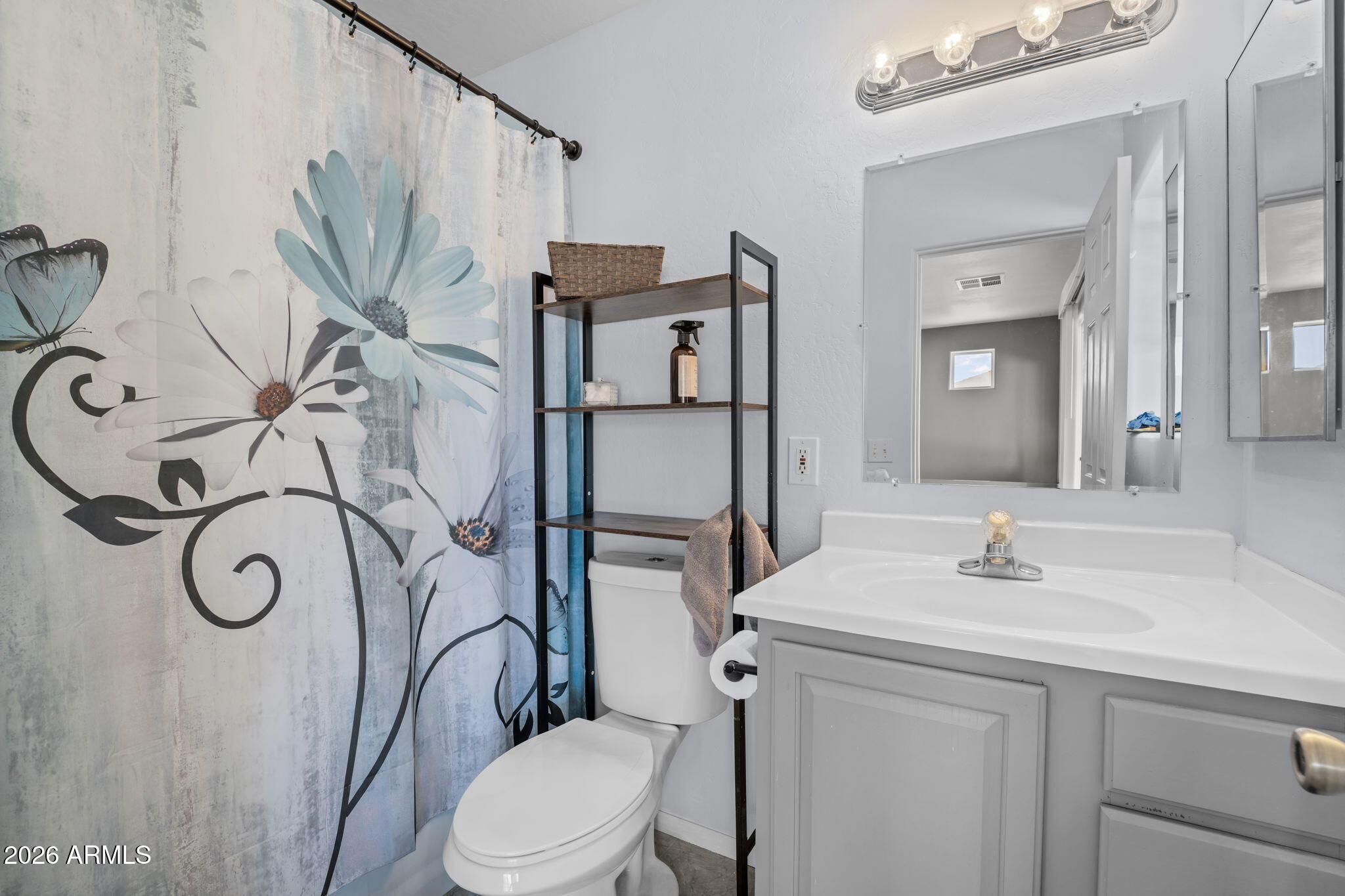 27144 Bennett Way Congress, AZ 85332 - Photo 13 of 33 a bathroom with a sink vanity mirror and toilet