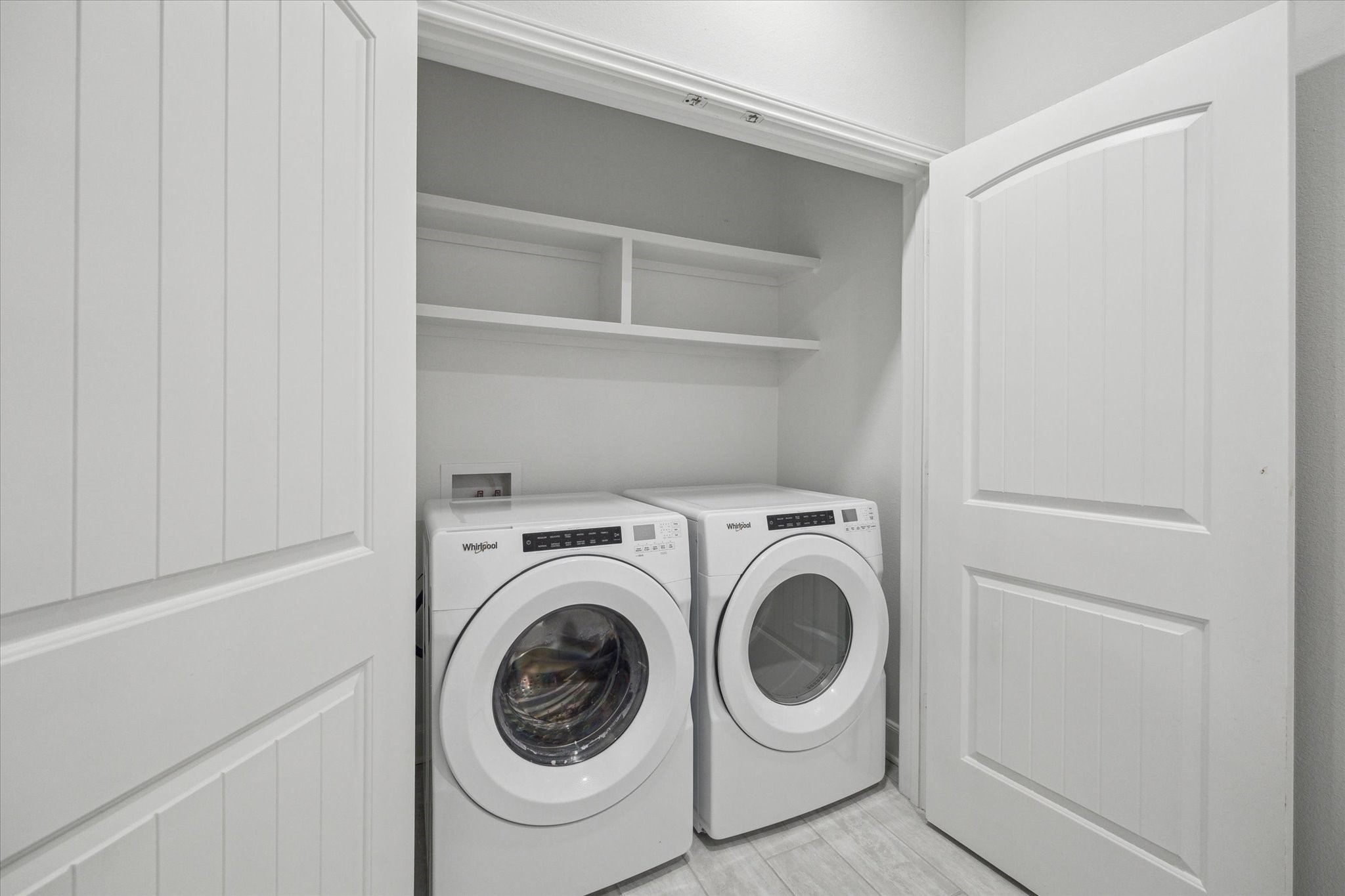 6804 Westview Drive, Unit 1407 Houston, TX 77055 - Photo 16 of 31 The utility room is inside of the unit - the washer and dryer are included.