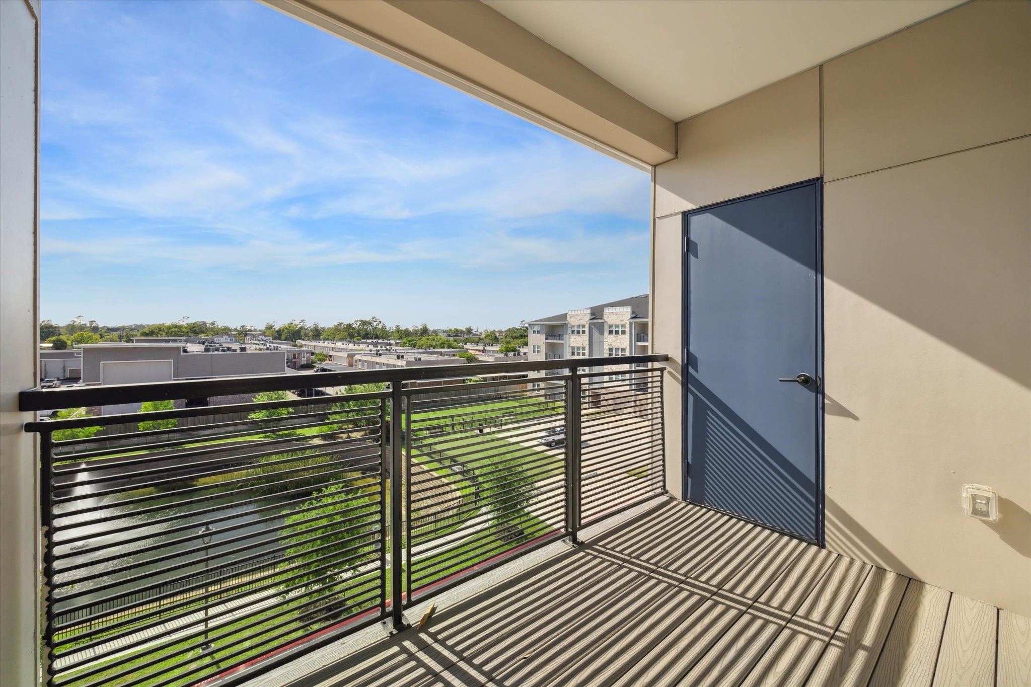 6804 Westview Drive, Unit 1407 Houston, TX 77055 - Photo 17 of 31 Covered balcony with a storage room. Enjoy the view of the community pond.