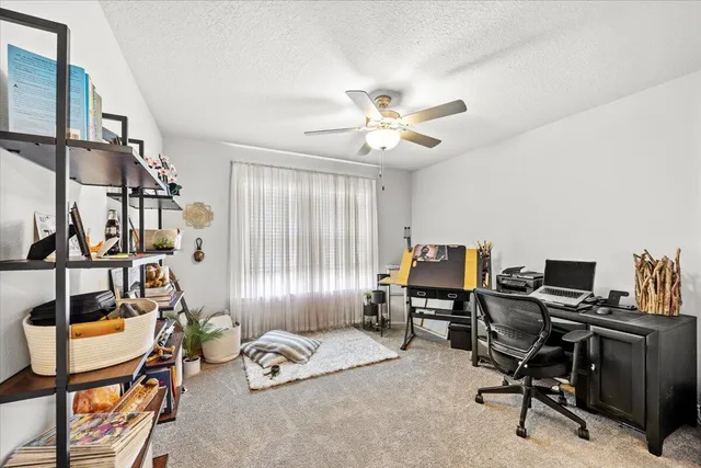 a workspace with furniture and a window