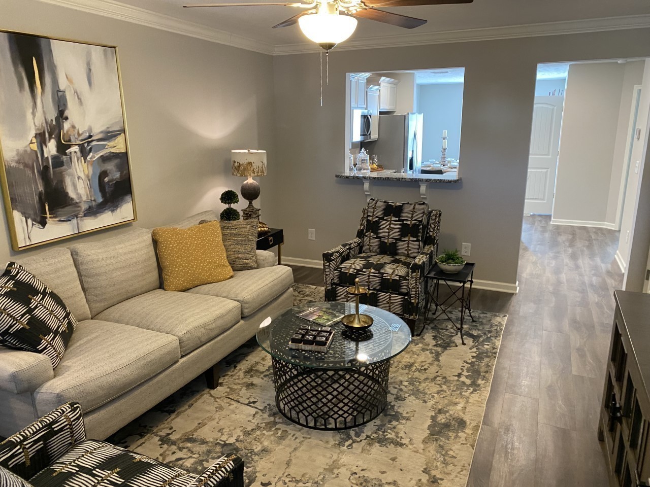 317 Ezra Street Pleasant View, TN 37146 - Photo 2 of 11 a living room with furniture and a chandelier