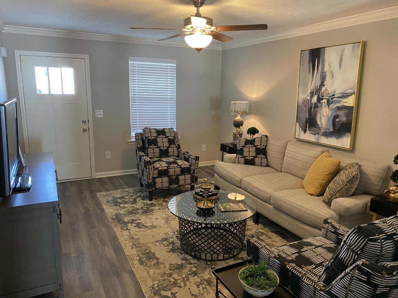 317 Ezra Street Pleasant View, TN 37146 - Photo 3 of 11 a living room with furniture and a chandelier