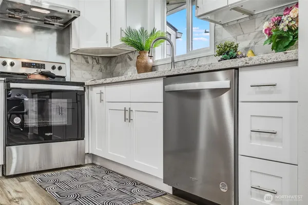 a kitchen with a counter top space and cabinets