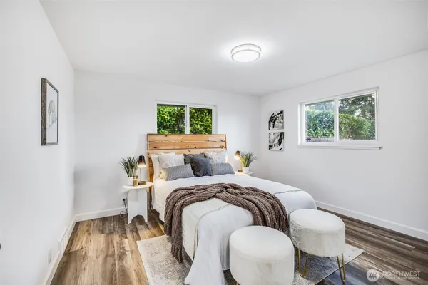 a bedroom with bed and a window