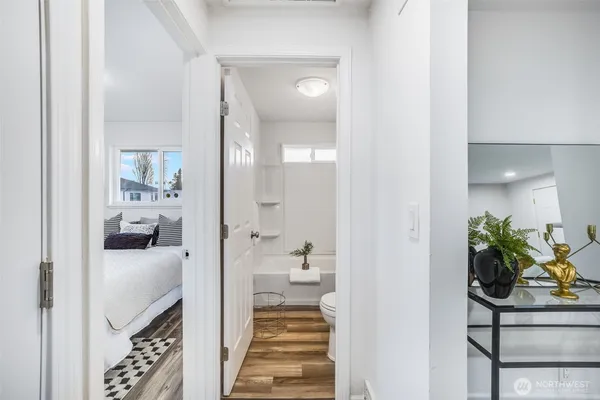a hallway with a dining table and chairs