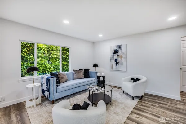 a living room with furniture and a large window