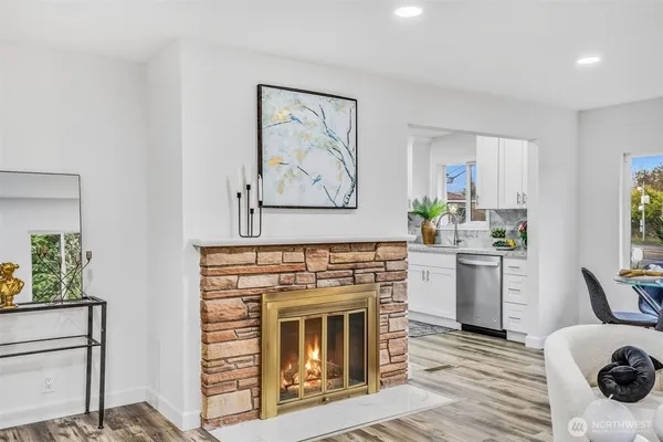 a kitchen with a stove top oven and sink