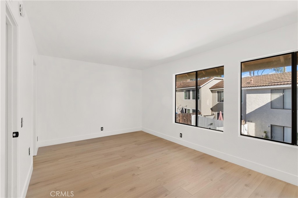 25885 Trabuco Road, Unit 91 Lake Forest, CA 92630 - Photo 18 of 36 an empty room with windows and closet