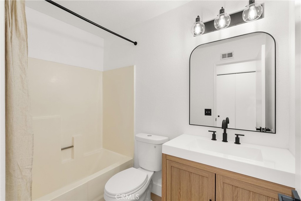 25885 Trabuco Road, Unit 91 Lake Forest, CA 92630 - Photo 22 of 36 a bathroom with a sink a toilet and shower