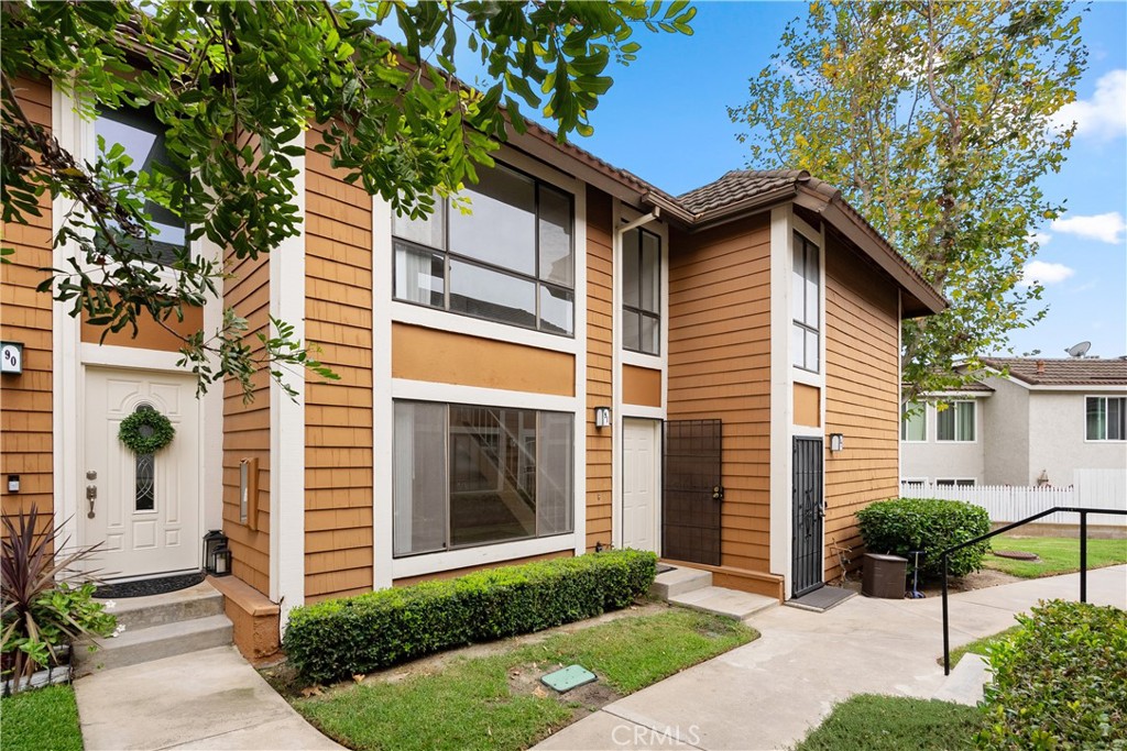 25885 Trabuco Road, Unit 91 Lake Forest, CA 92630 - Photo 27 of 36 a front view of a house with a yard