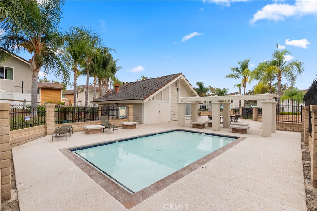 25885 Trabuco Road, Unit 91 Lake Forest, CA 92630 - Photo 29 of 36 a view of a house with swimming pool and sitting area