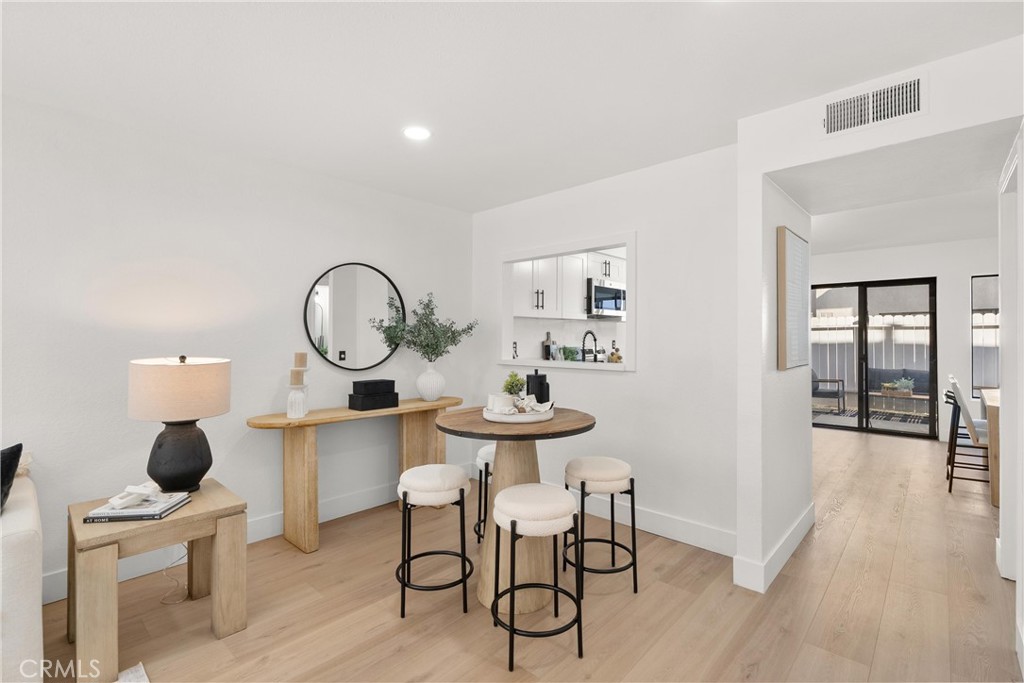 25885 Trabuco Road, Unit 91 Lake Forest, CA 92630 - Photo 5 of 36 a view of a kitchen with a table and chairs