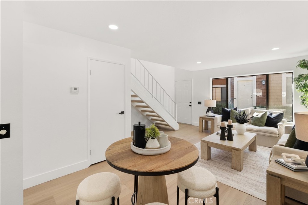 25885 Trabuco Road, Unit 91 Lake Forest, CA 92630 - Photo 6 of 36 a living room with furniture and a wooden floor
