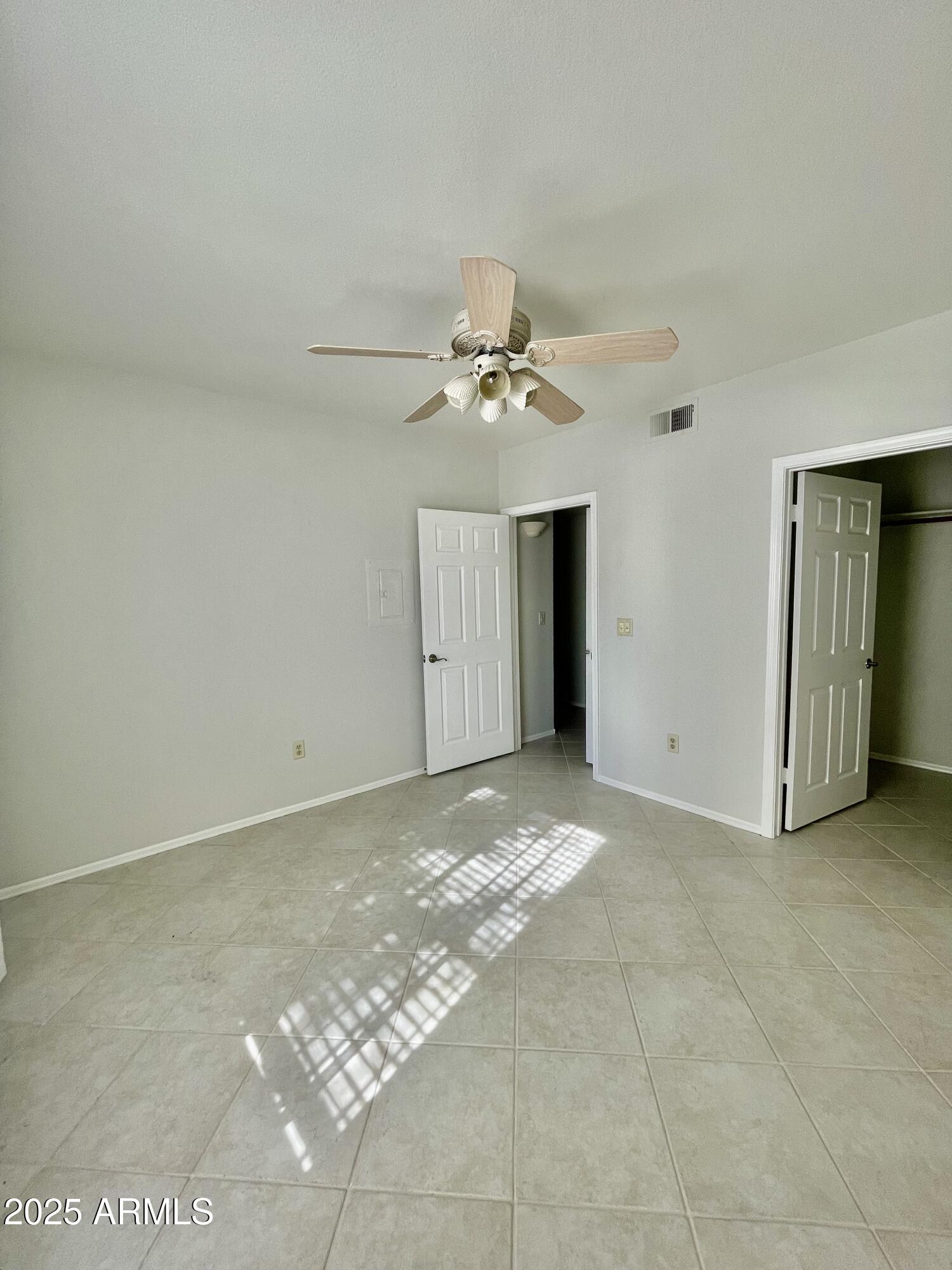 750 East Northern Avenue, Unit 1047 Phoenix, AZ 85020 - Photo 11 of 19 a view of a livingroom with a ceiling fan and window