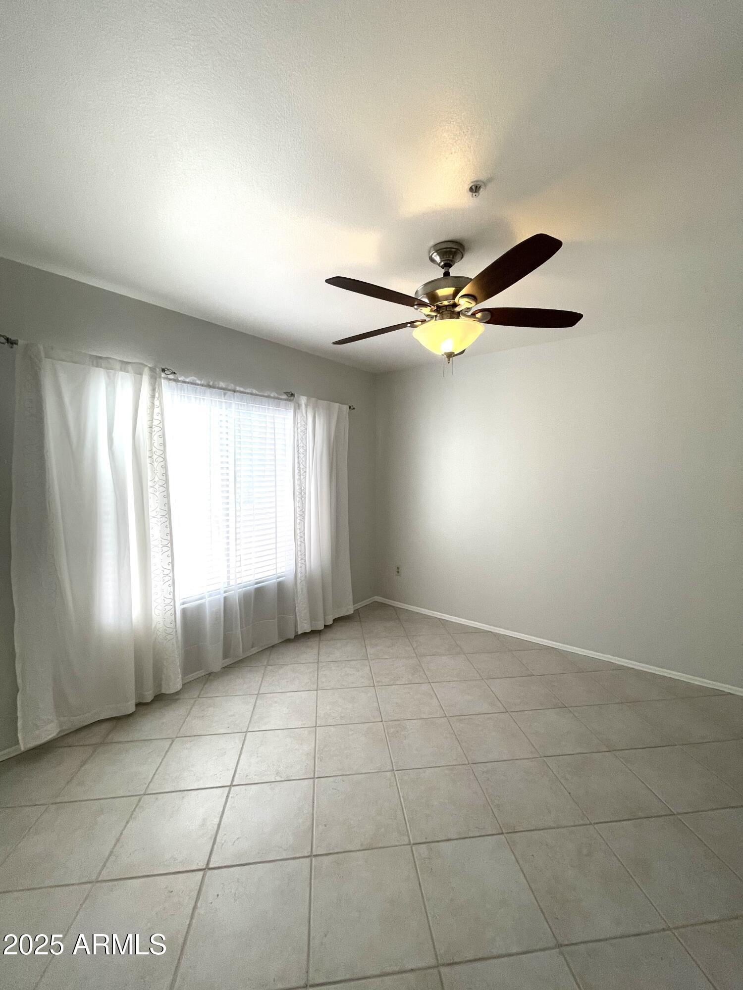 750 East Northern Avenue, Unit 1047 Phoenix, AZ 85020 - Photo 12 of 19 a view of an empty room with a window