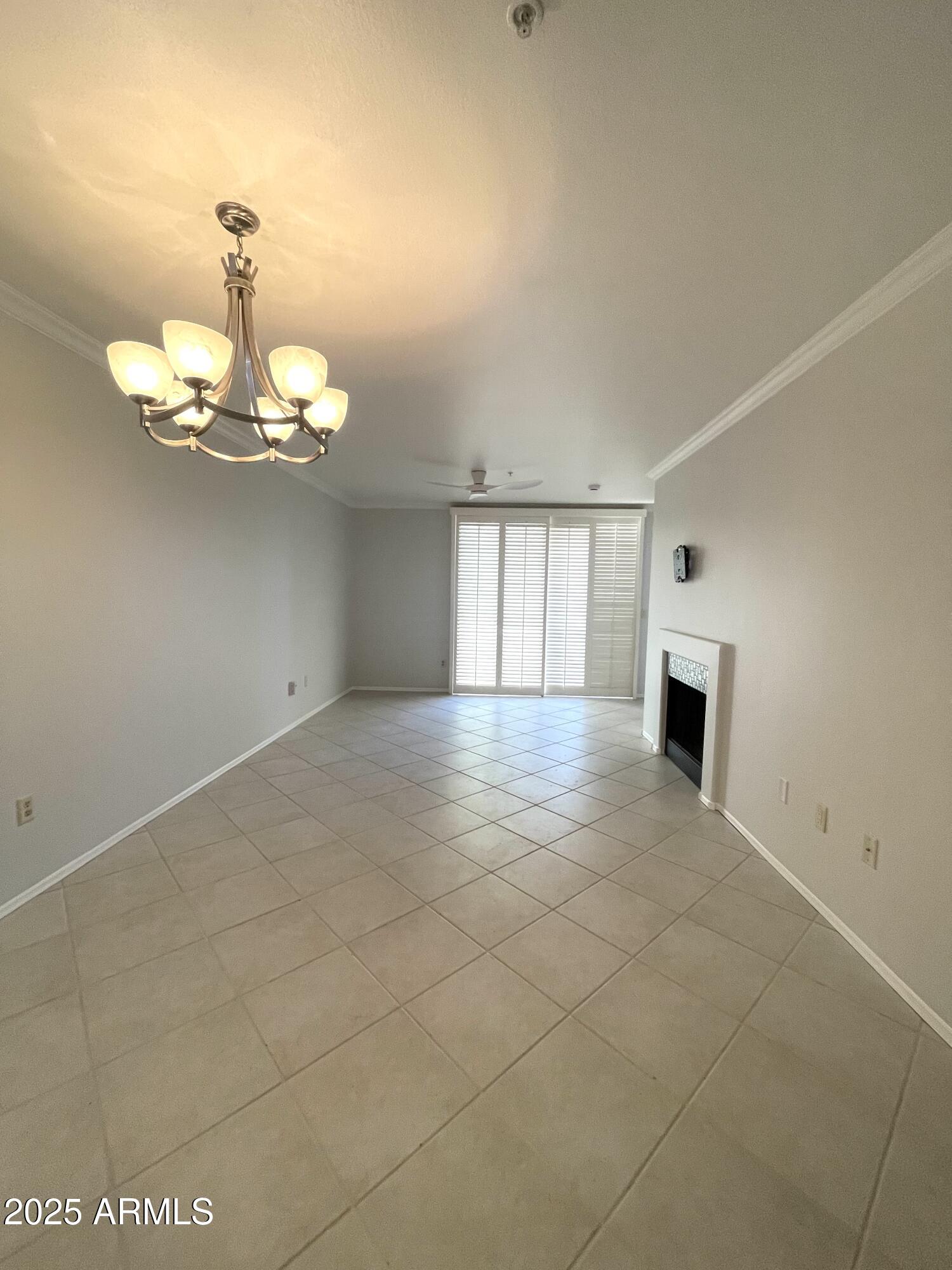 750 East Northern Avenue, Unit 1047 Phoenix, AZ 85020 - Photo 4 of 19 a view of a room with a chandelier