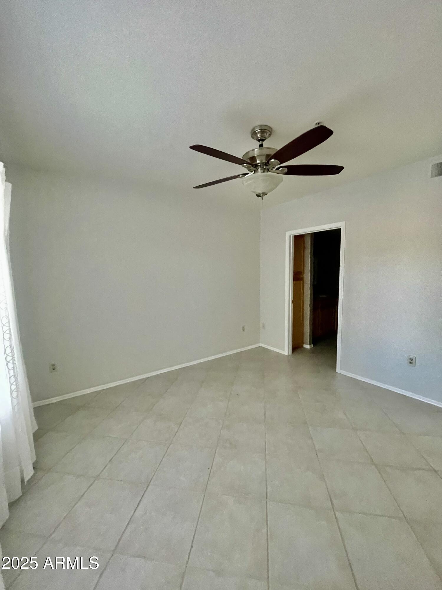750 East Northern Avenue, Unit 1047 Phoenix, AZ 85020 - Photo 7 of 19 a view of an empty room with a window