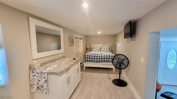 a bedroom with a bed and a table in it