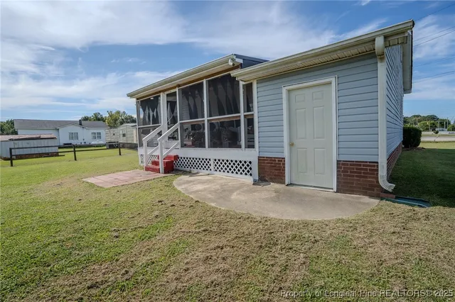 a view of a house with swimming pool and porch