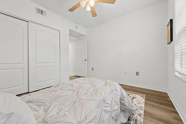 a bed room with a bed and a chandelier