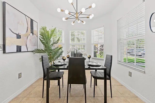 a view of a dining room with furniture window and outside view