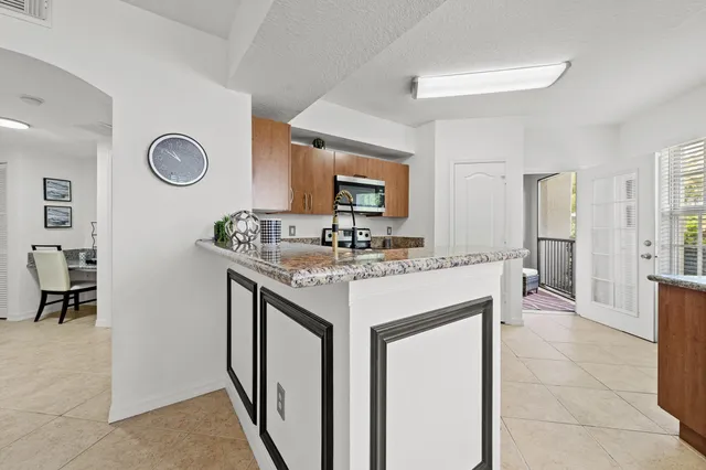 a kitchen with a sink and a refrigerator