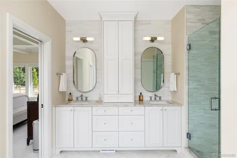 a white bath tub sitting in a bathroom next to a window