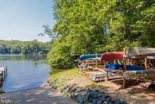Kings Court Montross, VA 22520 - Photo 11 of 15 a view of a patio with lawn chairs under an umbrella