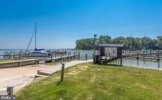 a swimming pool with lawn chairs