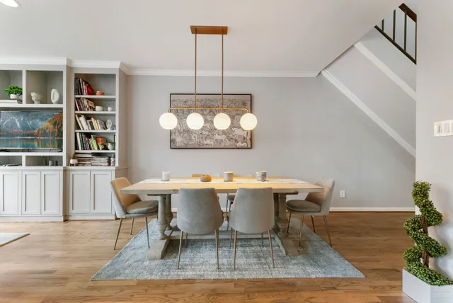 a view of a dining room with furniture window and wooden floor
