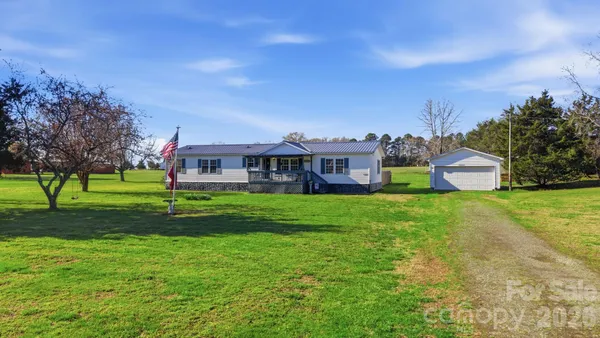 a view of a house with a big yard