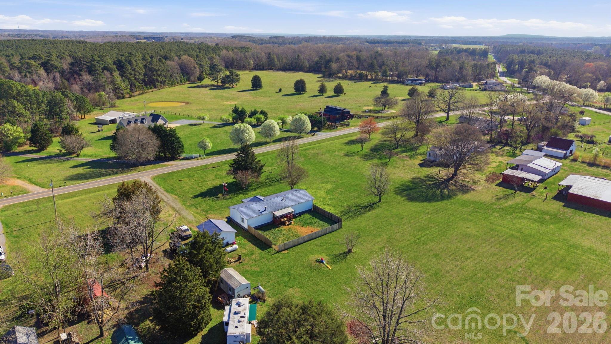 139 Old Fallston Road Cherryville, NC 28021 - Photo 11 of 47 an aerial view of a house with a yard