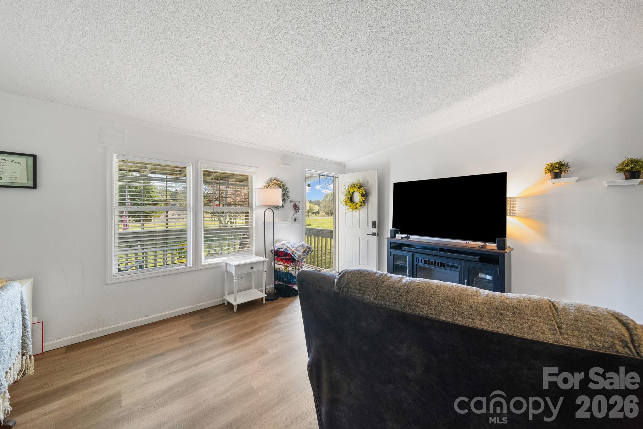 139 Old Fallston Road Cherryville, NC 28021 - Photo 14 of 47 a living room with furniture and a flat screen tv