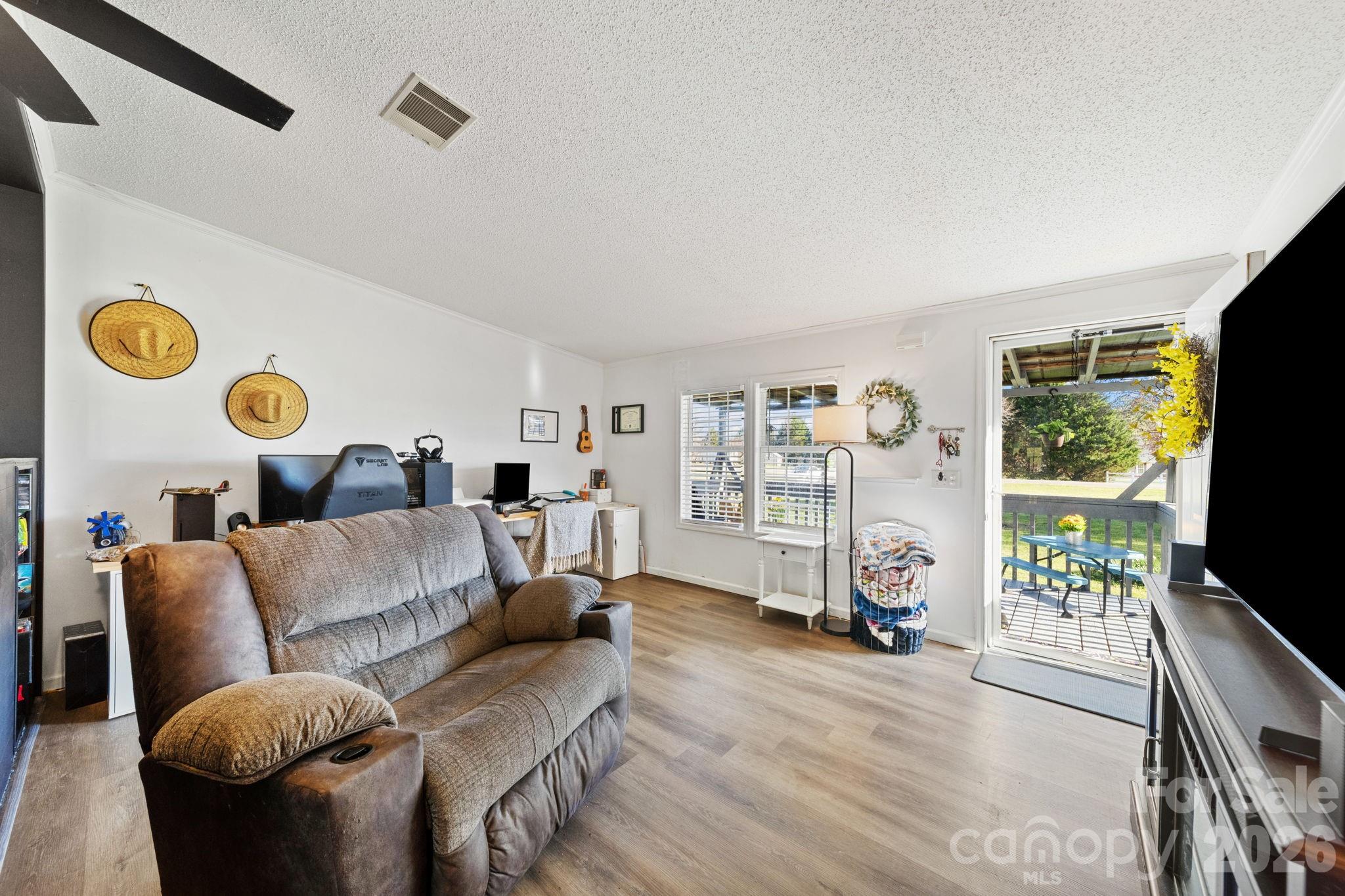 139 Old Fallston Road Cherryville, NC 28021 - Photo 15 of 47 a living room with furniture and a flat screen tv