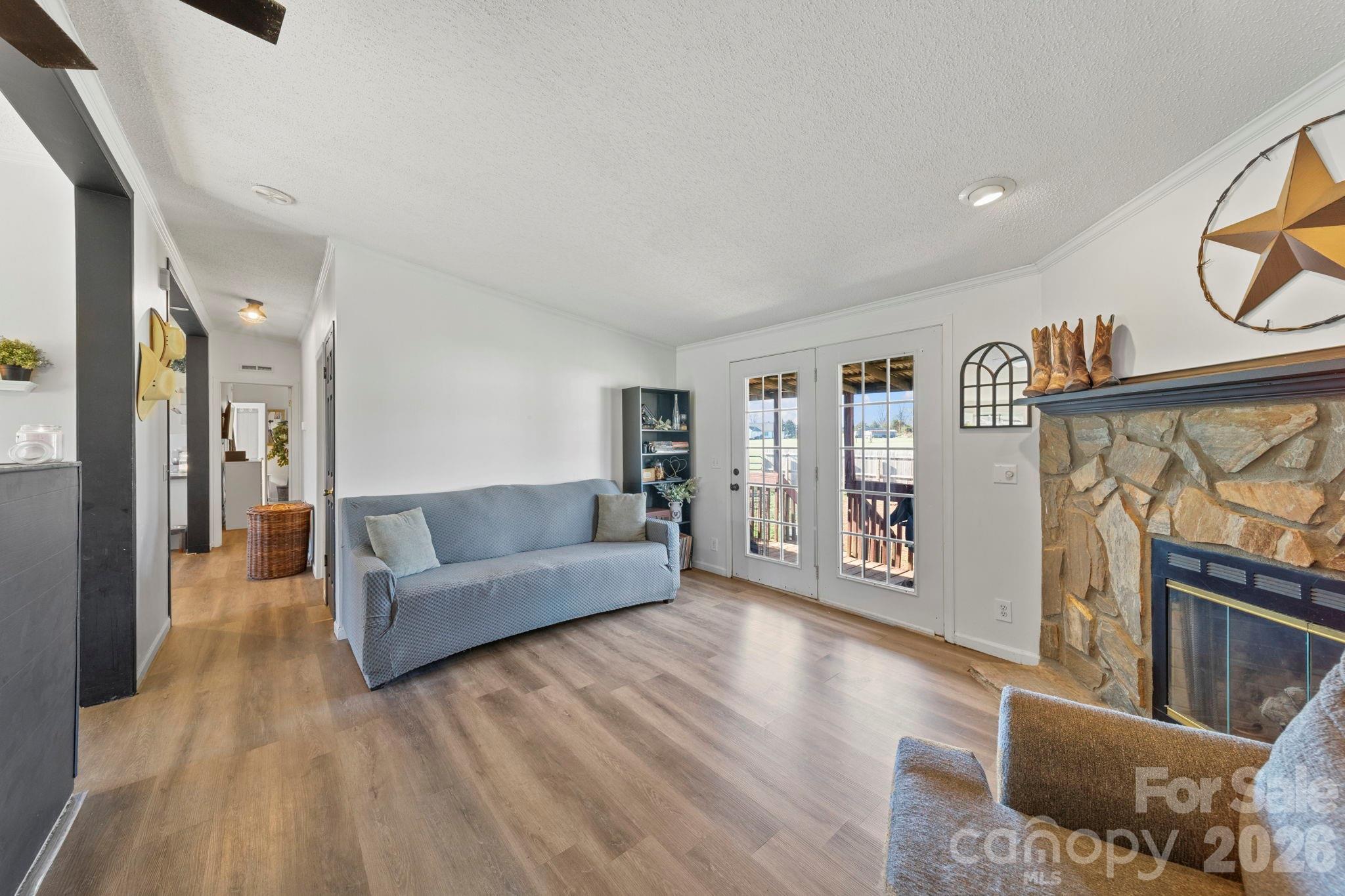 139 Old Fallston Road Cherryville, NC 28021 - Photo 16 of 47 a living room with furniture and a flat screen tv