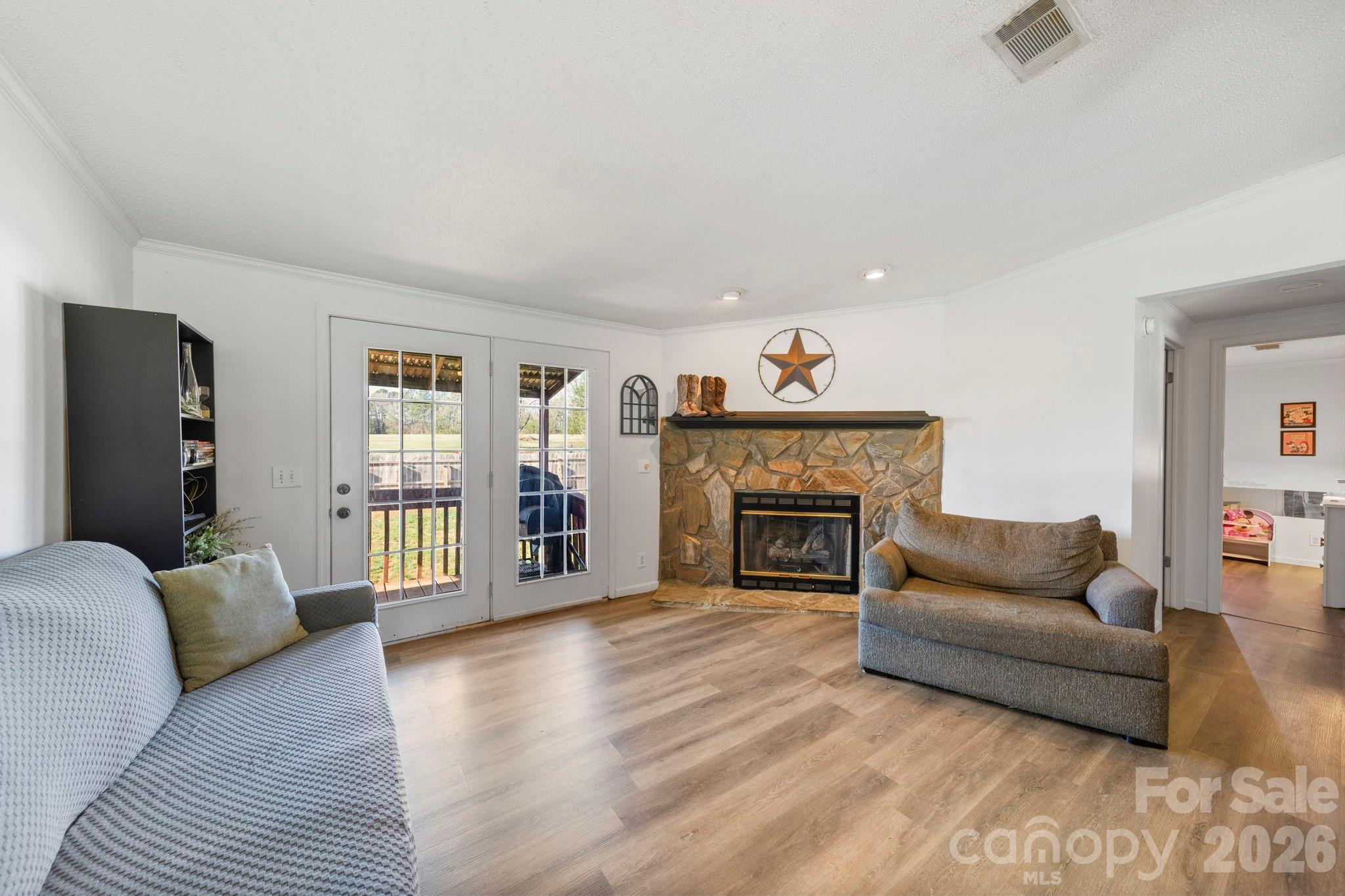 139 Old Fallston Road Cherryville, NC 28021 - Photo 17 of 47 a living room with furniture and a fireplace