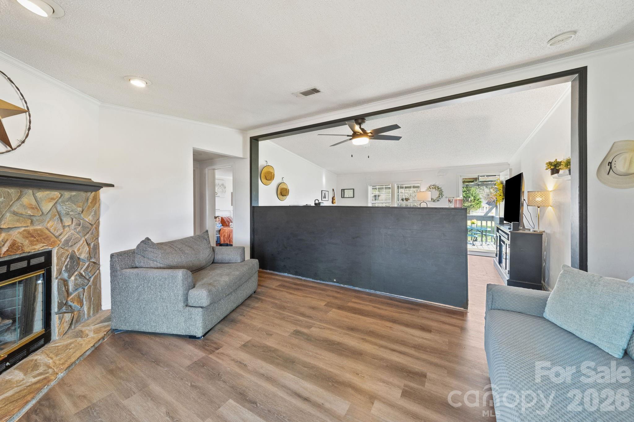 139 Old Fallston Road Cherryville, NC 28021 - Photo 18 of 47 a living room with furniture and a fireplace