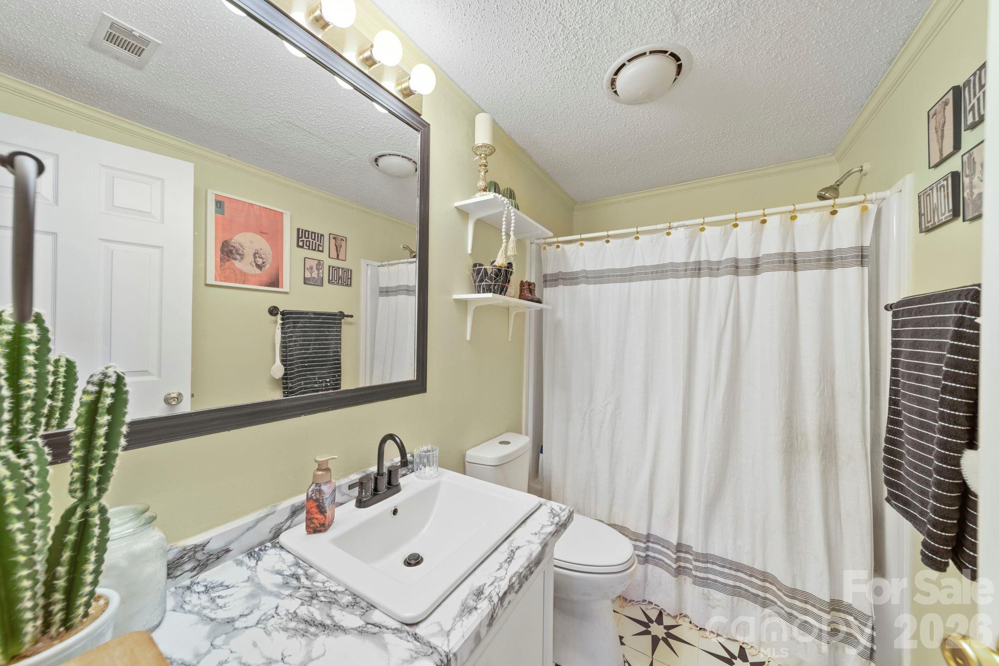 139 Old Fallston Road Cherryville, NC 28021 - Photo 19 of 47 a bathroom with a sink toilet and shower