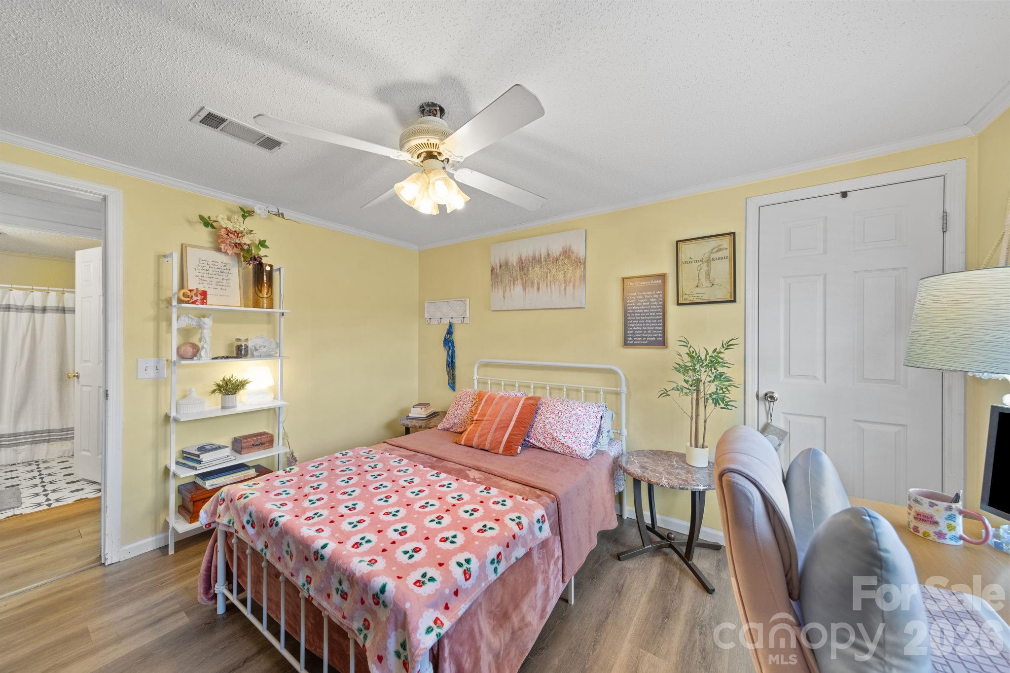 139 Old Fallston Road Cherryville, NC 28021 - Photo 20 of 47 a bedroom with a bed and wooden floor