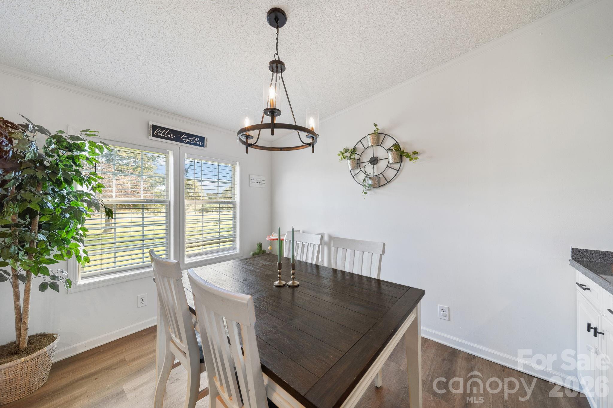 139 Old Fallston Road Cherryville, NC 28021 - Photo 25 of 47 a view of a dining room with furniture window and wooden floor
