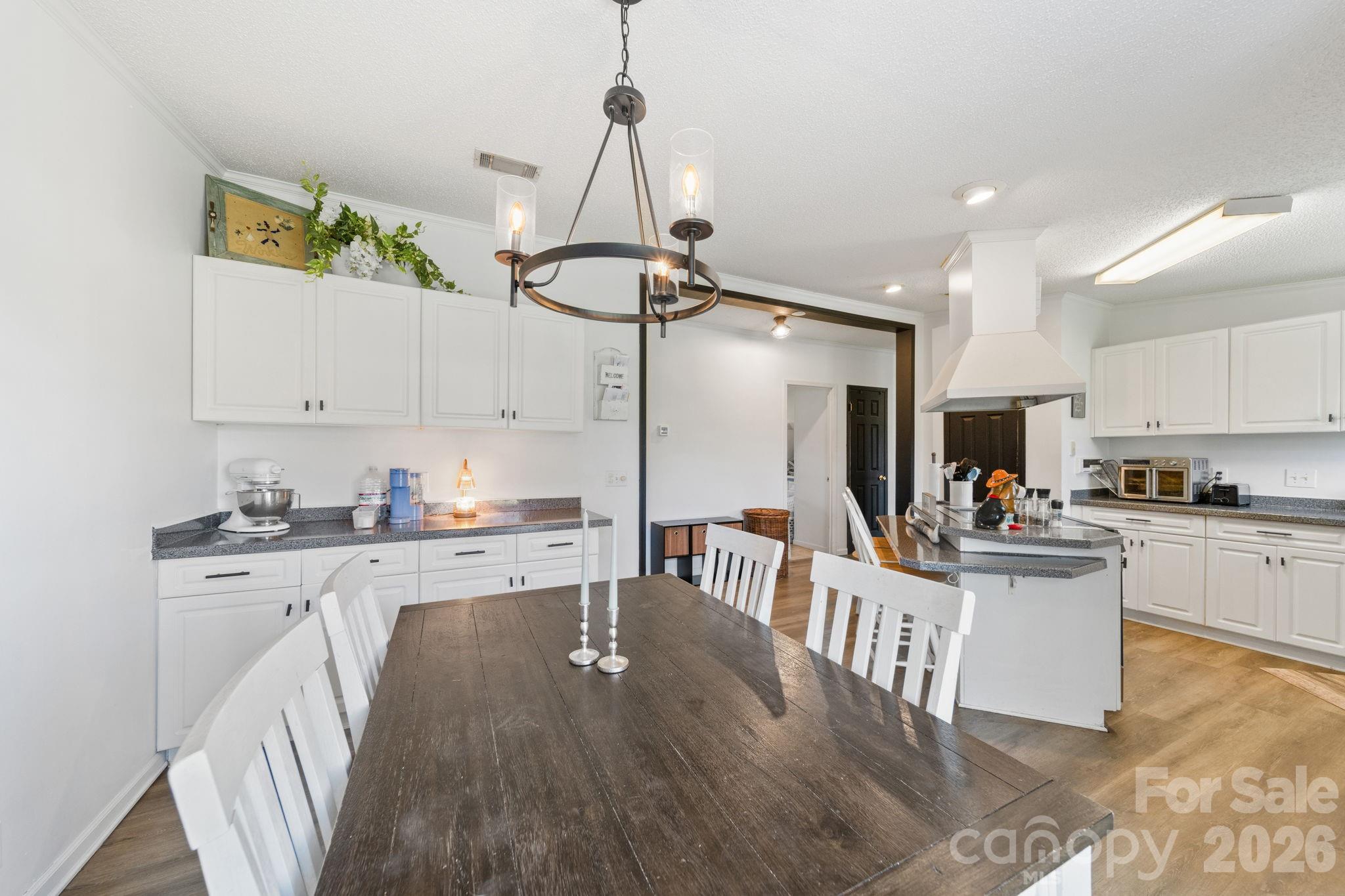 139 Old Fallston Road Cherryville, NC 28021 - Photo 28 of 47 a kitchen with white cabinets a sink and appliances