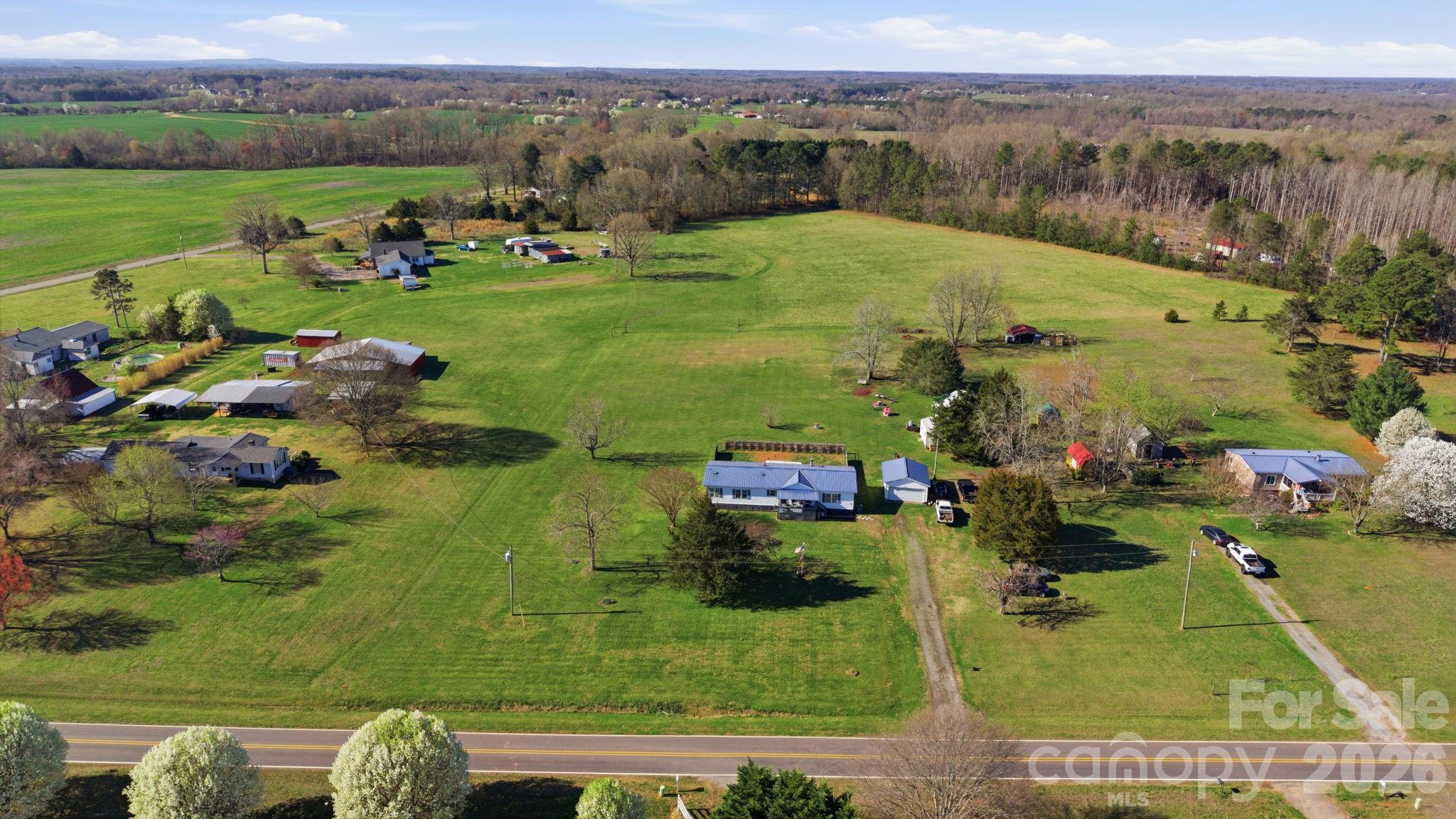 139 Old Fallston Road Cherryville, NC 28021 - Photo 3 of 47 a view of a garden with an ocean