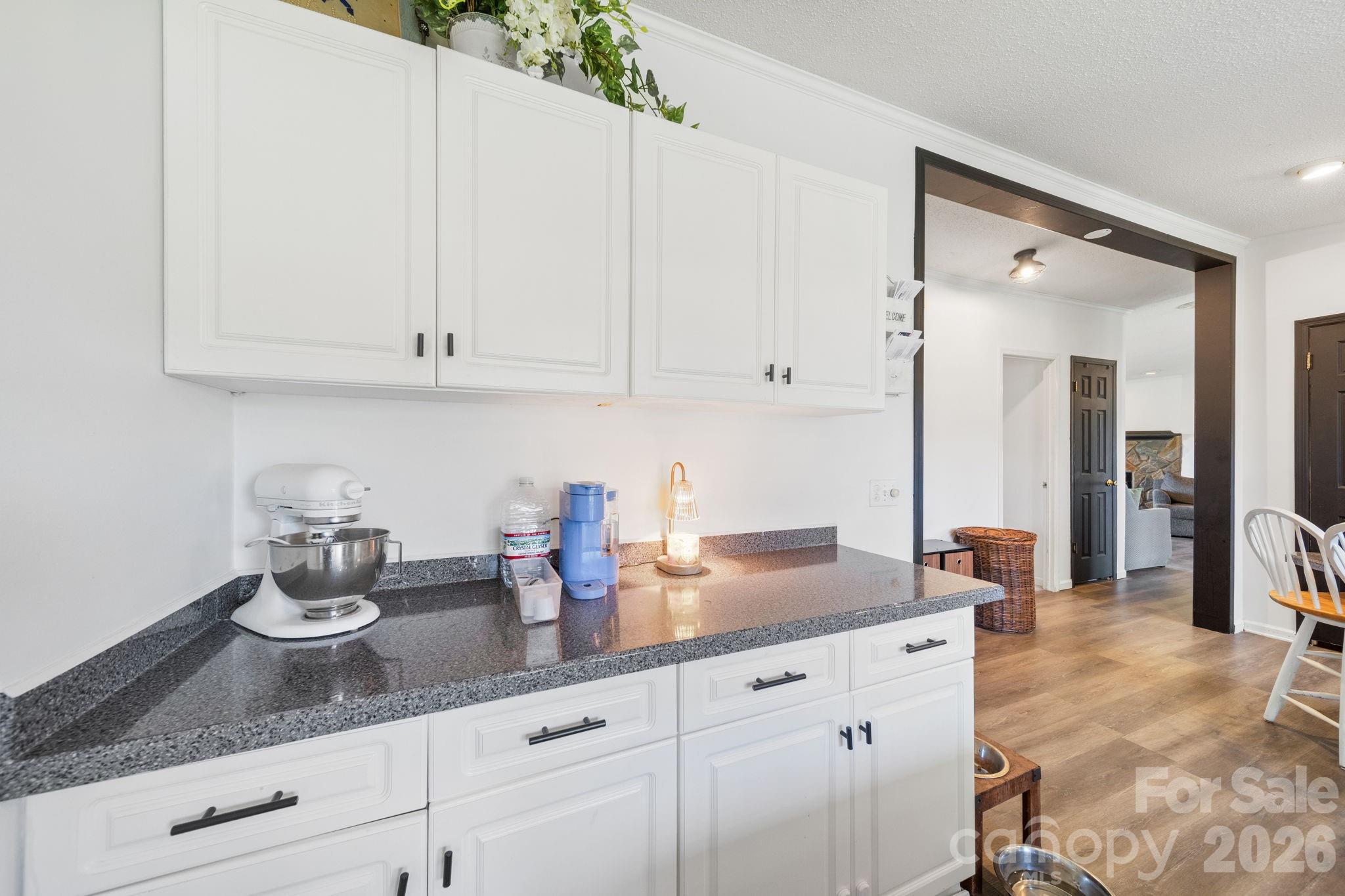 139 Old Fallston Road Cherryville, NC 28021 - Photo 32 of 47 a kitchen with white cabinets and a sink