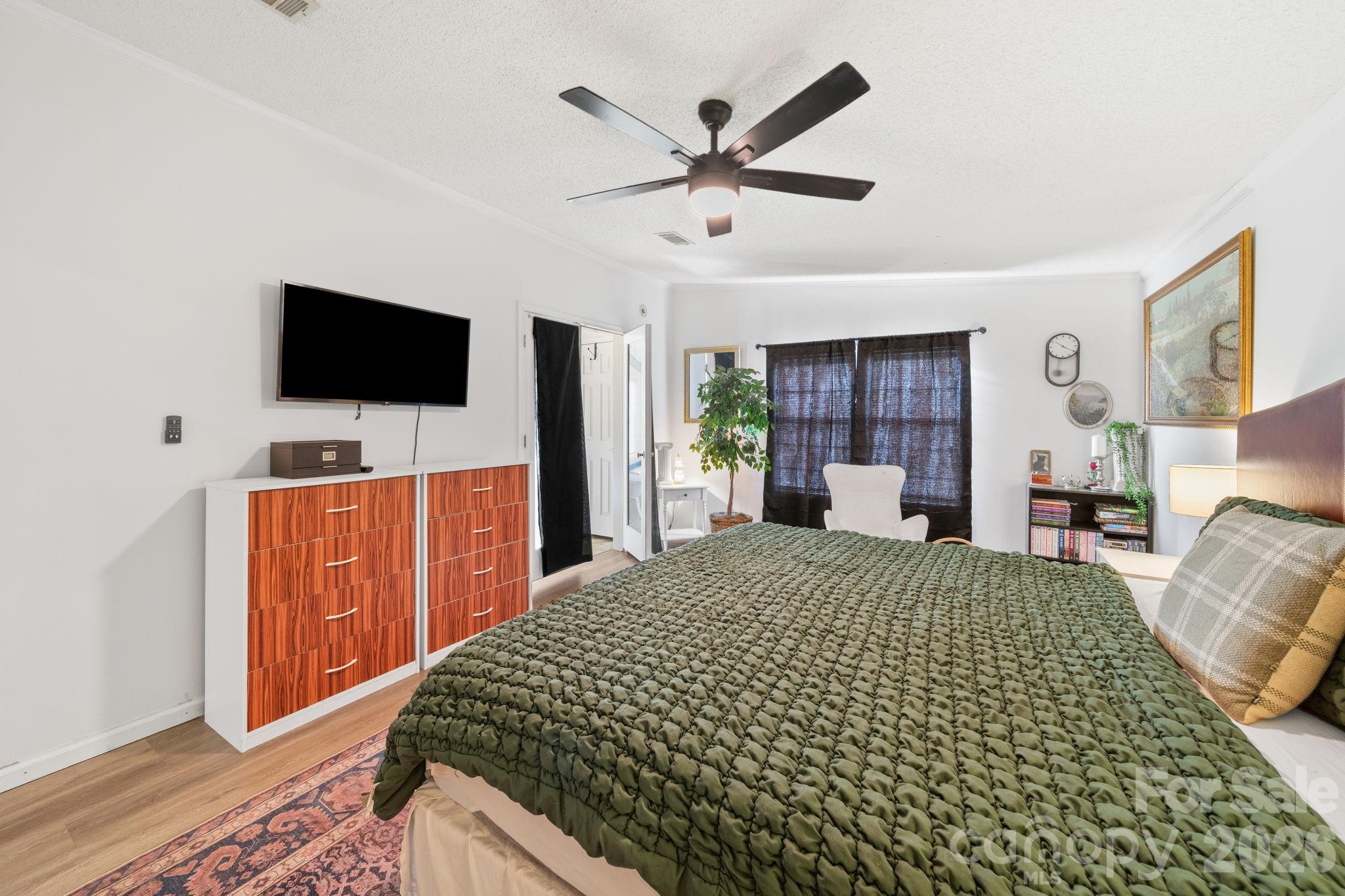 139 Old Fallston Road Cherryville, NC 28021 - Photo 35 of 47 a bedroom with a bed and a flat screen tv
