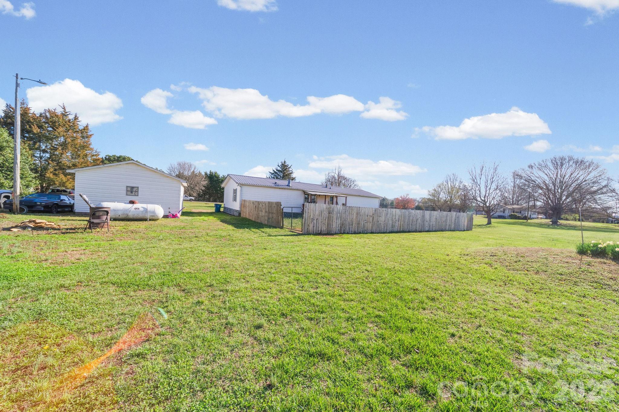 139 Old Fallston Road Cherryville, NC 28021 - Photo 41 of 47 a view of a house with a yard and sitting area