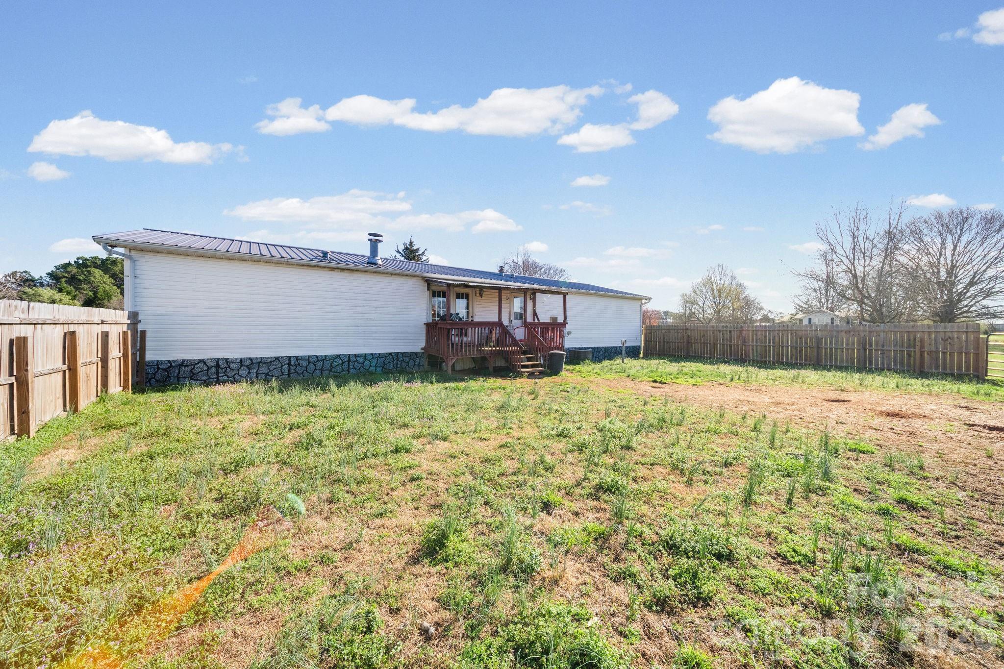 139 Old Fallston Road Cherryville, NC 28021 - Photo 42 of 47 a view of a house with a yard