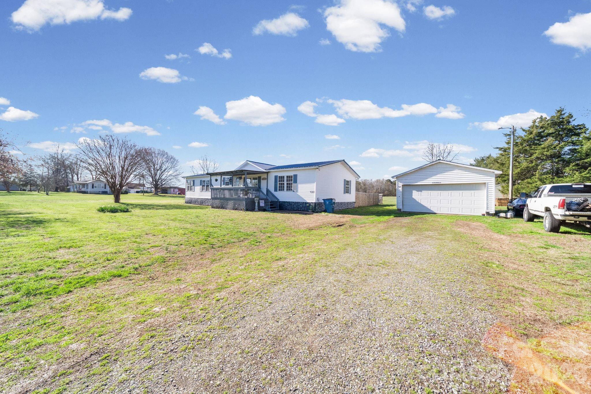 139 Old Fallston Road Cherryville, NC 28021 - Photo 46 of 47 a house view with swimming pool and trees in the background