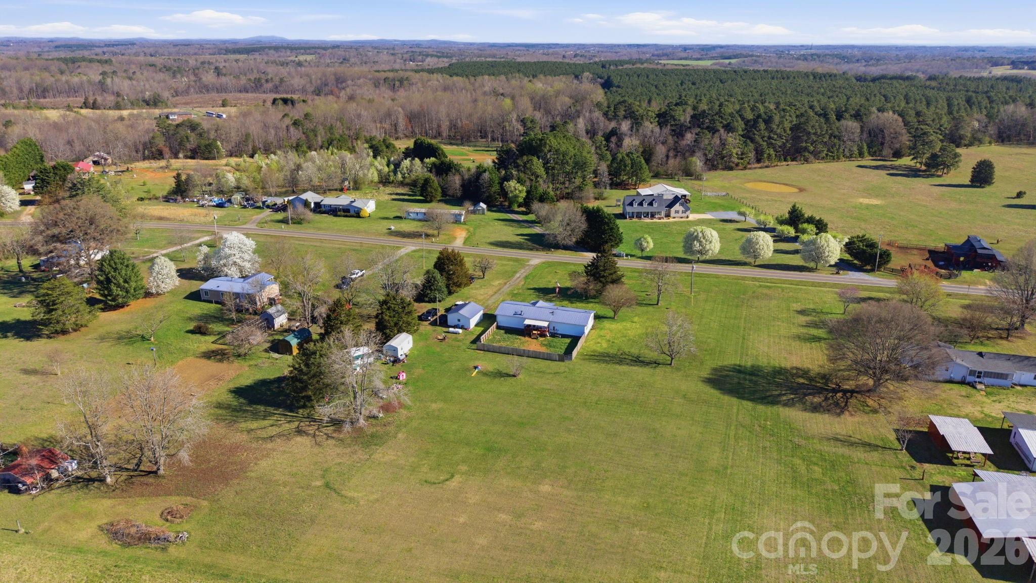 139 Old Fallston Road Cherryville, NC 28021 - Photo 6 of 47 a view of a lake with houses