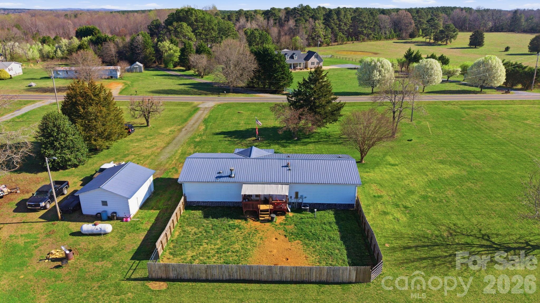 139 Old Fallston Road Cherryville, NC 28021 - Photo 9 of 47 an aerial view of a house with a yard basket ball court and outdoor seating
