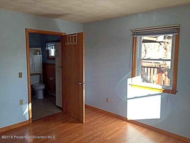 1668 Pennay Hill Road Kingsley, PA 18826 - Photo 13 of 23 a view of an empty room with bathroom and a window